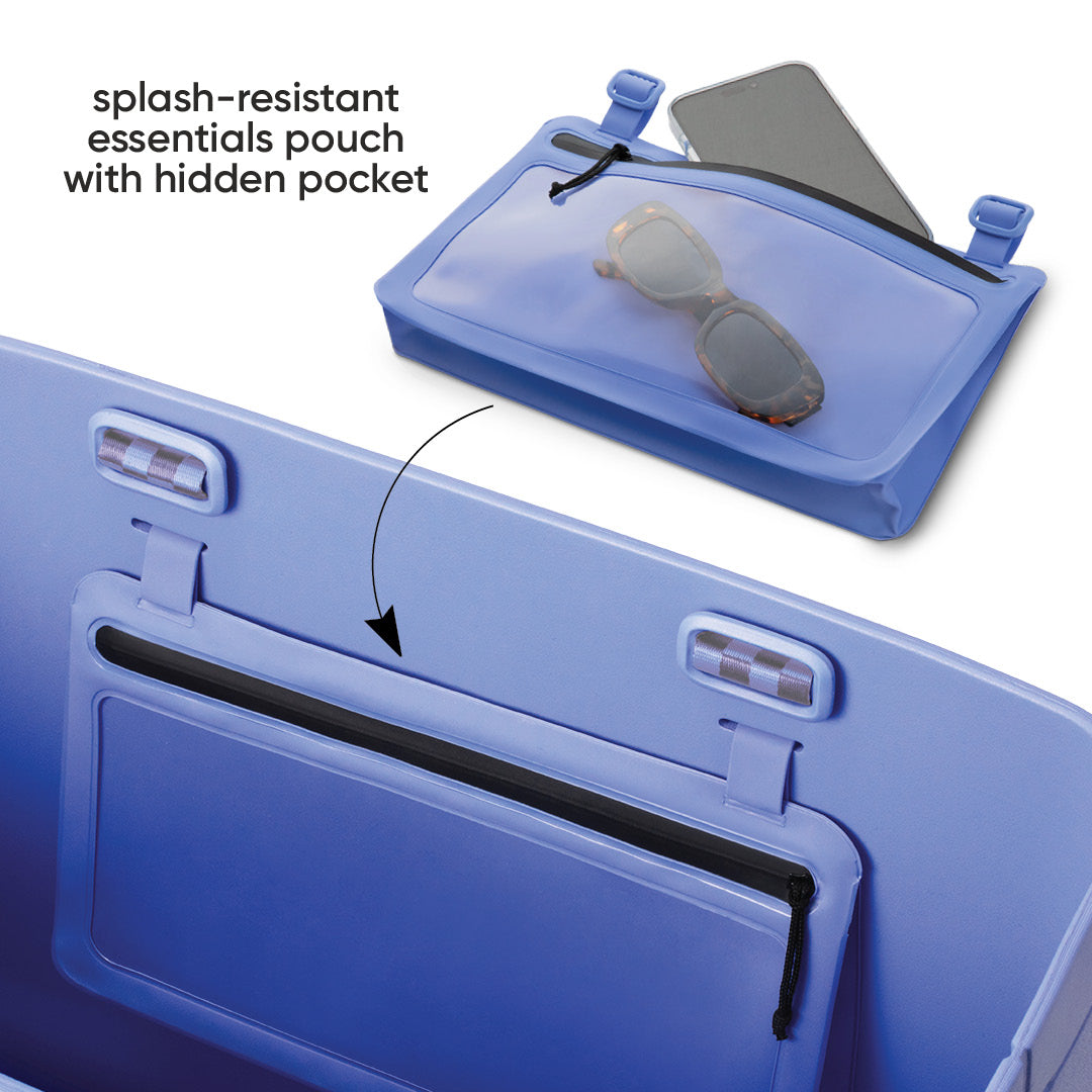 Owala Sun-Day Collapsible Tote in Wavelength showing the splash-resistant essentials pouch detached above with a phone and sunglasses inside, and an arrow pointing to where it attaches on the periwinkle blue tote, with text overlay reading "splash-resistant essentials pouch with hidden pocket"