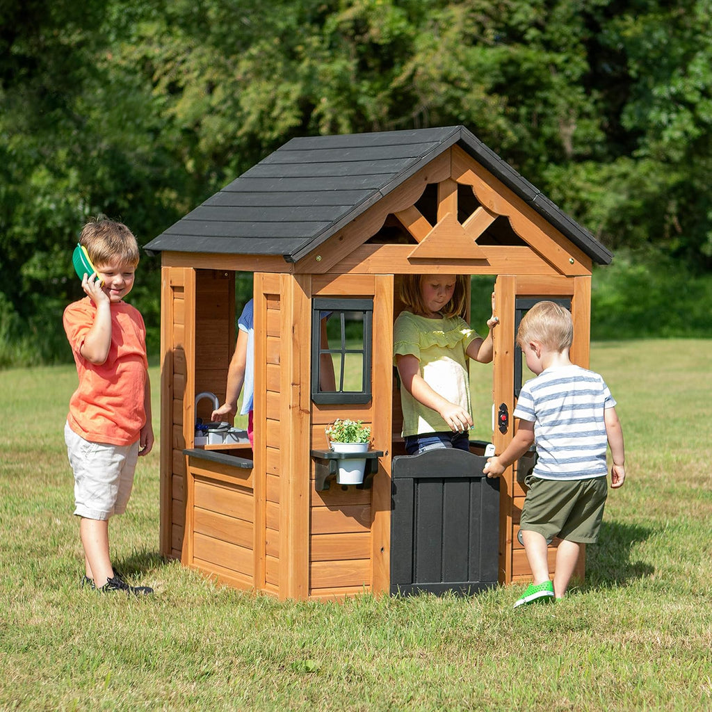 Children's playhouse cabin, equipped with a game kitchen, snack bar, half-door, toy phone, windows, flower pot stand and an operable doorbell, suitable for creative outdoor games.
