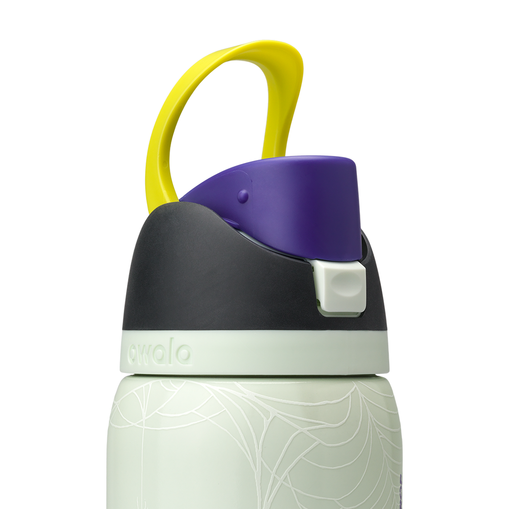 Owala FreeSip 32oz in RIP, close-up of black lid with pale mint accent band, purple flip cap with pale mint push-button and yellow carry loop standing up